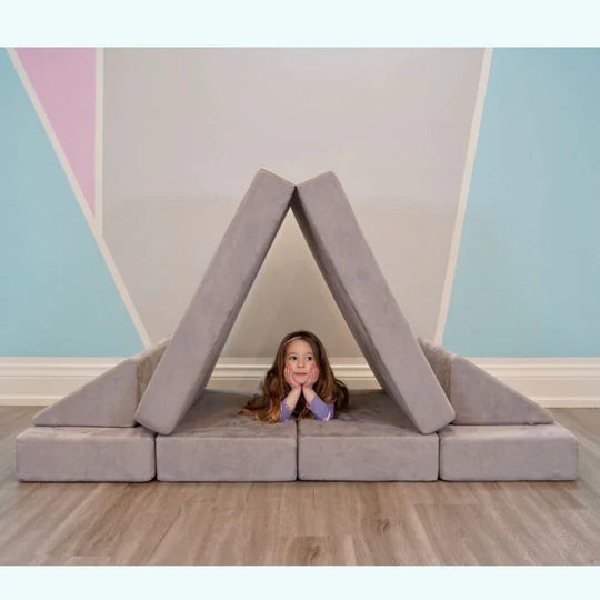 grey play couch in tent build