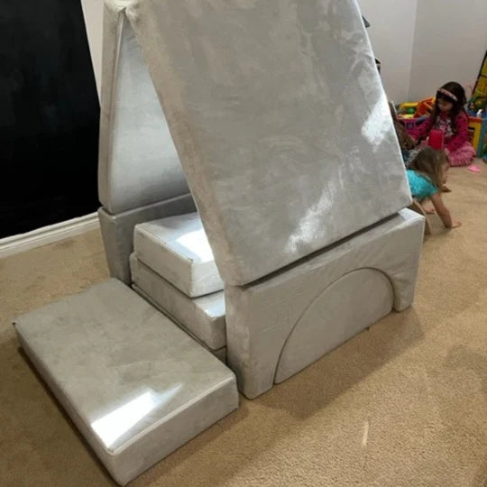 grey barumba play couch in a climbing build